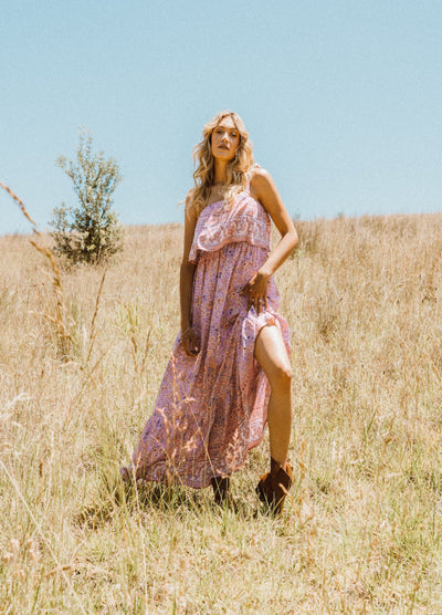 Model in the long grass wearing the love story maxi dress