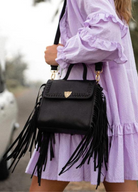 The Innerbloom black bag made in leather with fringing