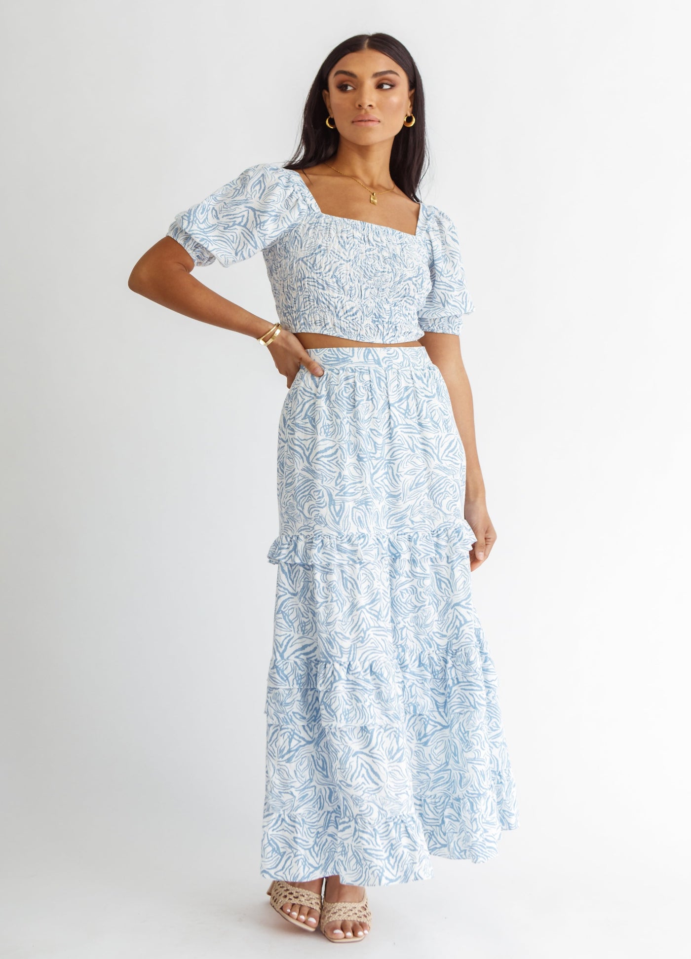 Woman wearing blue and white wave print top