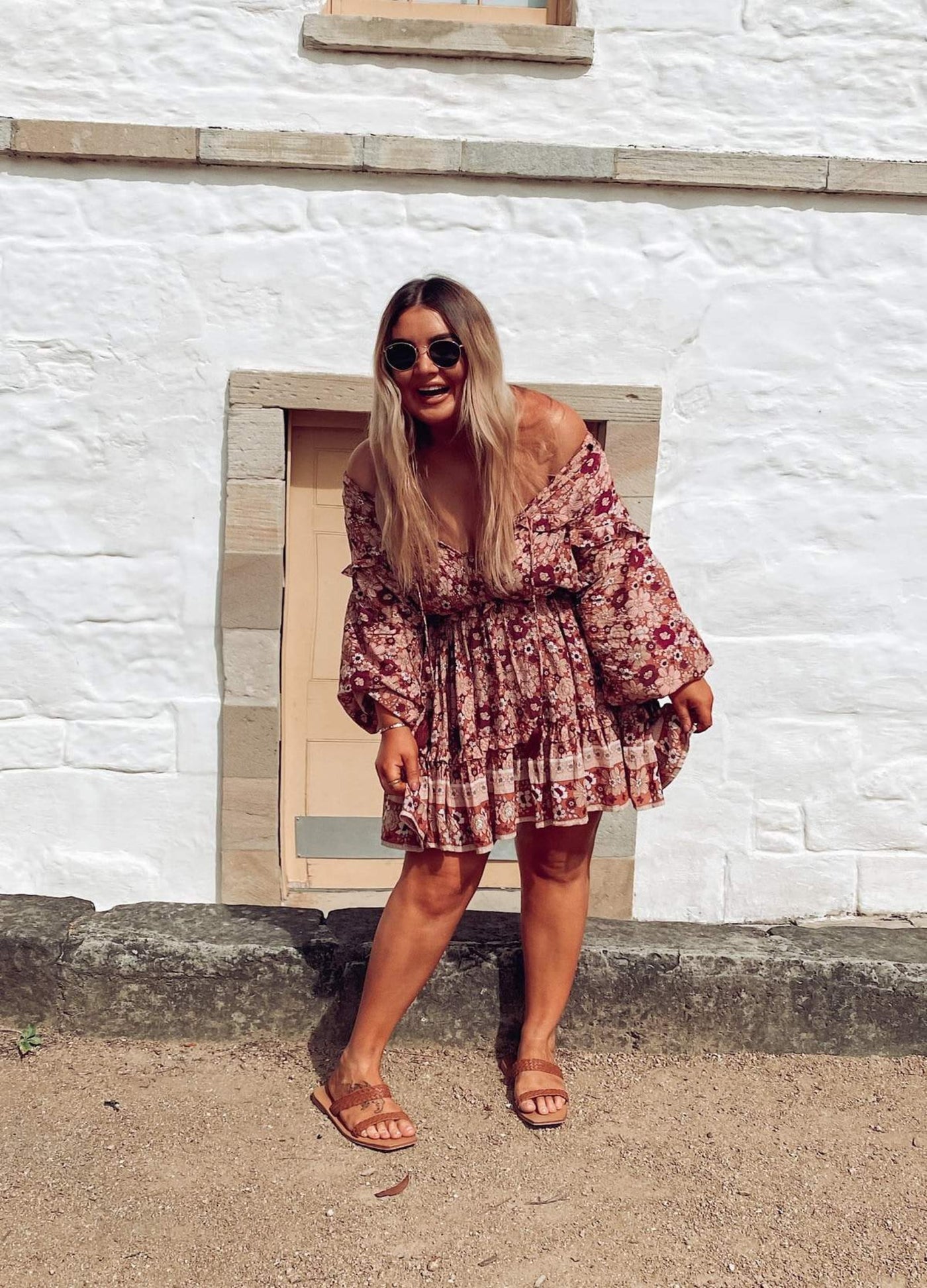 Curvy Woman wearing the Never Lost Mini Dress in Burgundy Print with tan sandals
