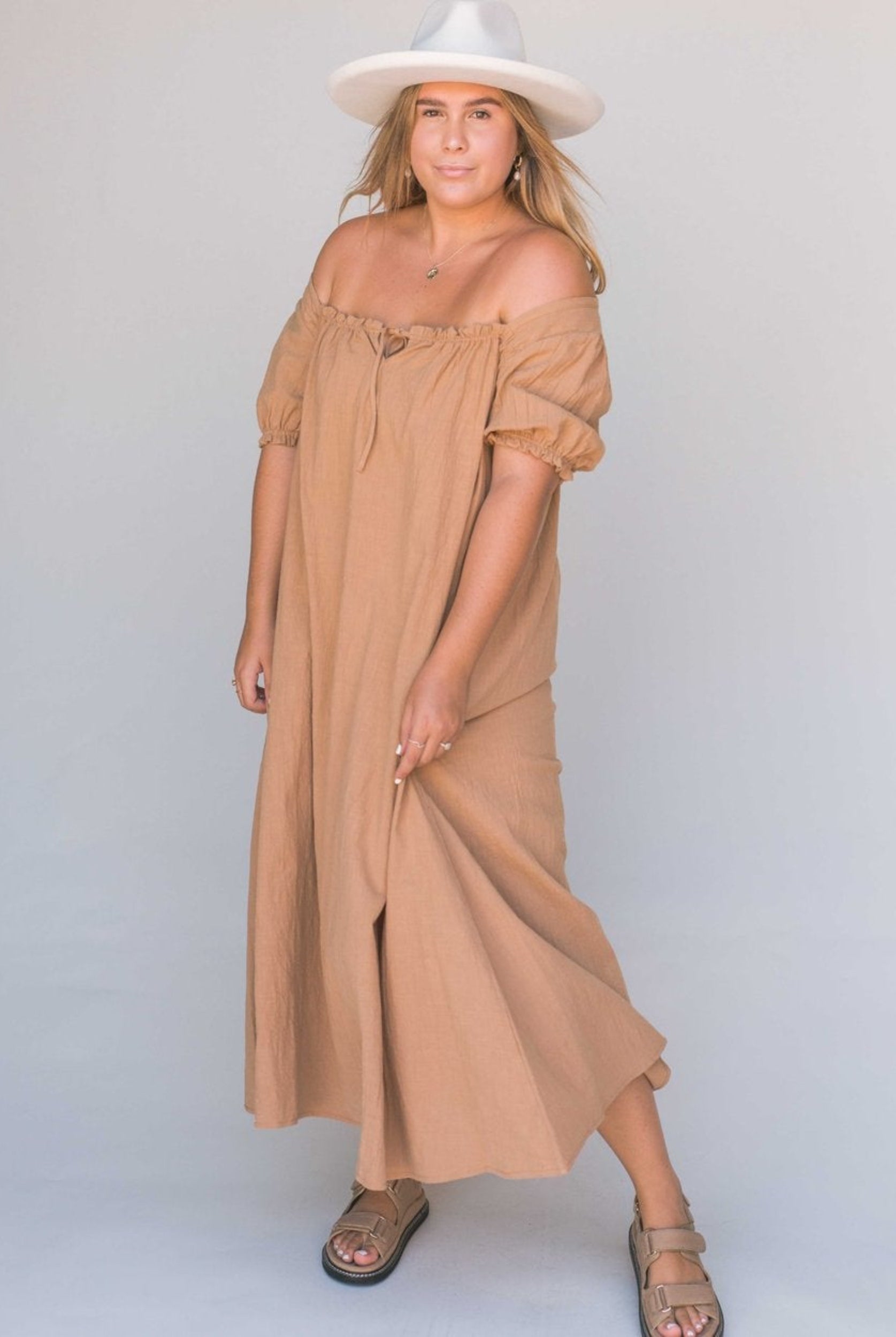 Model wearing beige midi dress