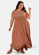 Brunette Model wears brown maxi dress