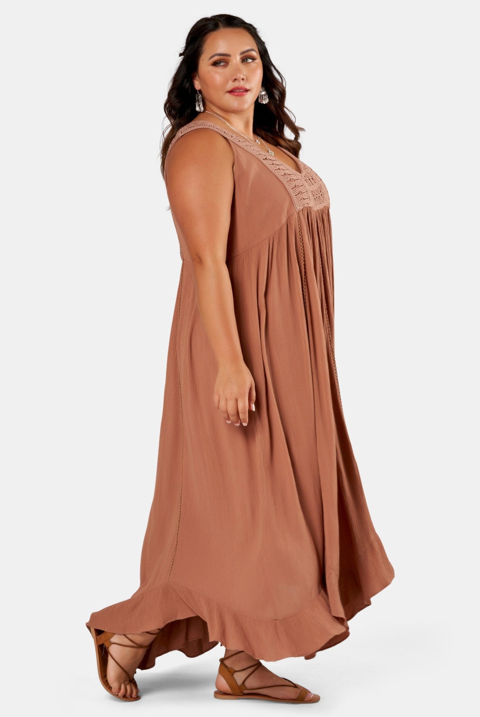Brunette Model wears brown maxi dress