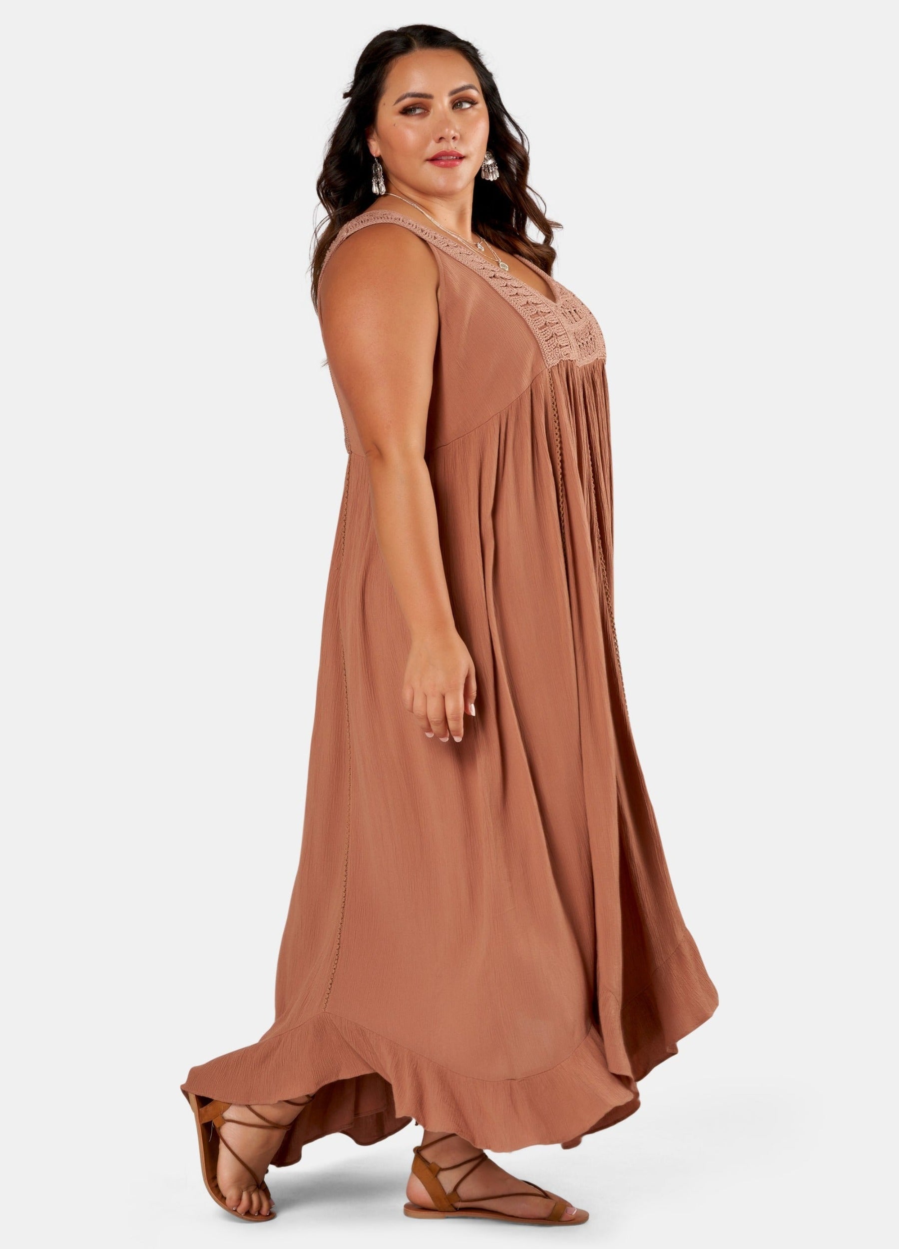 Brunette Model wears brown maxi dress