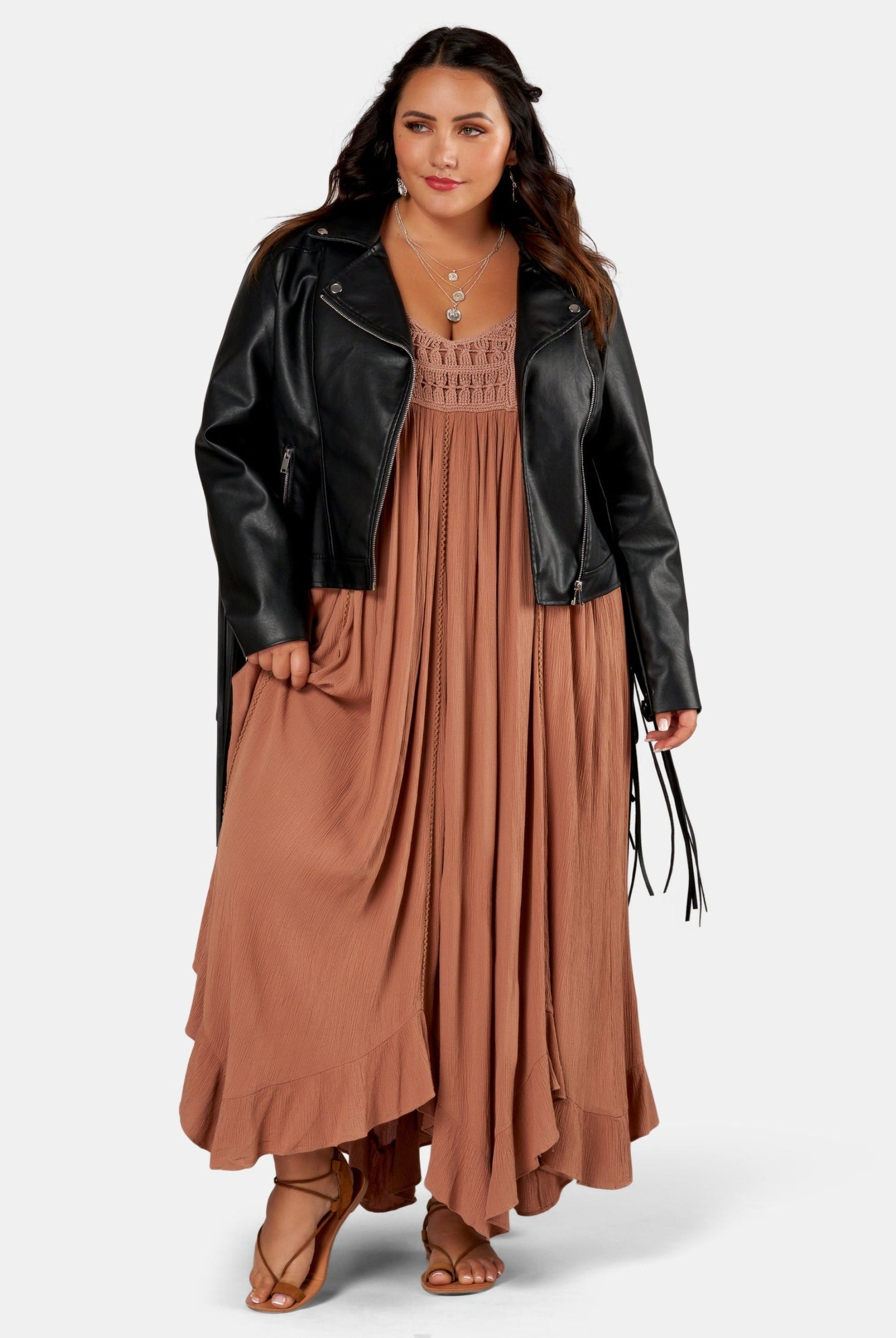 Brunette Model wears brown maxi dress with biker jacket