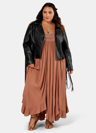 Brunette Model wears brown maxi dress with biker jacket