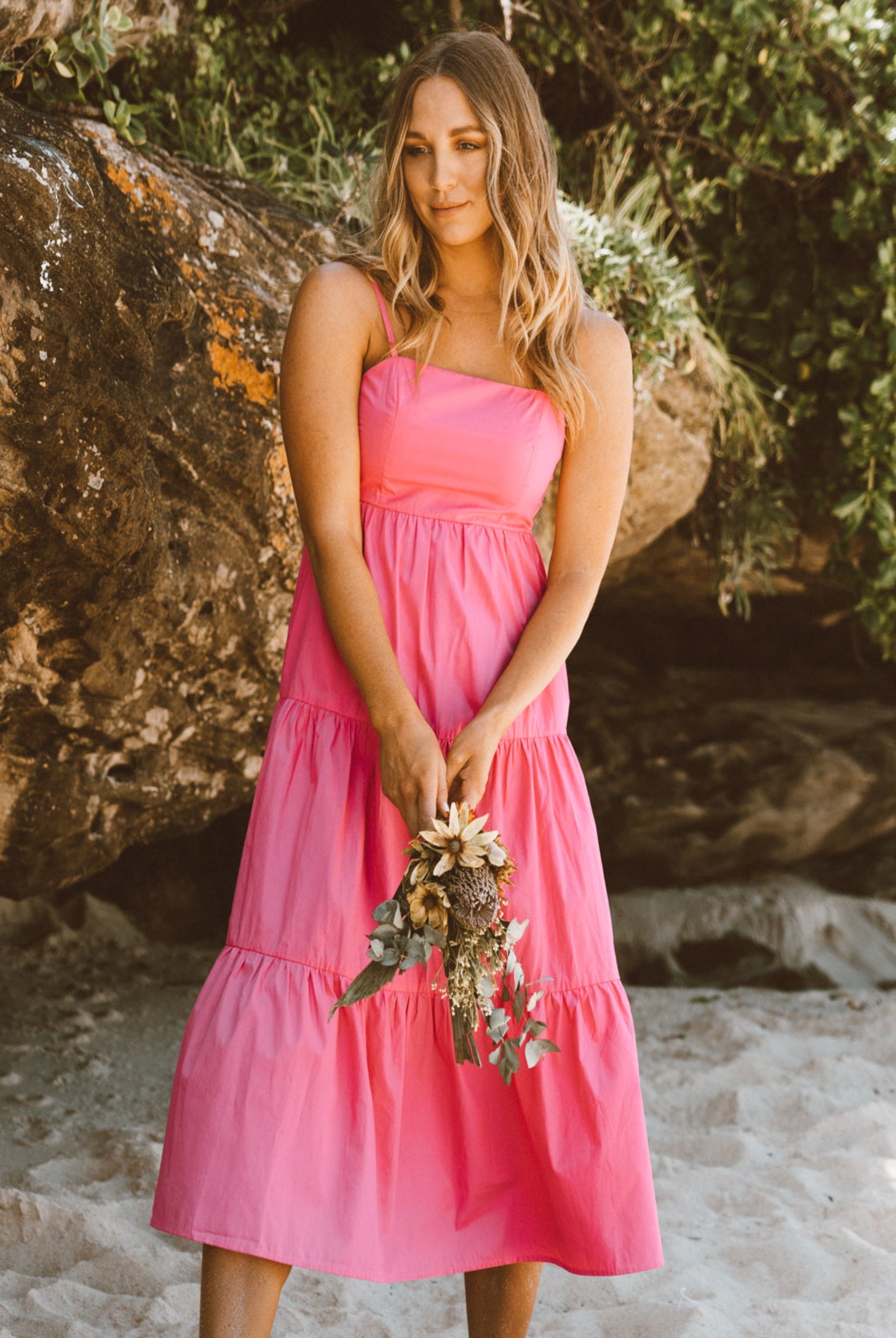 Model wearing the strappy matilda maxi dress in candy pink
