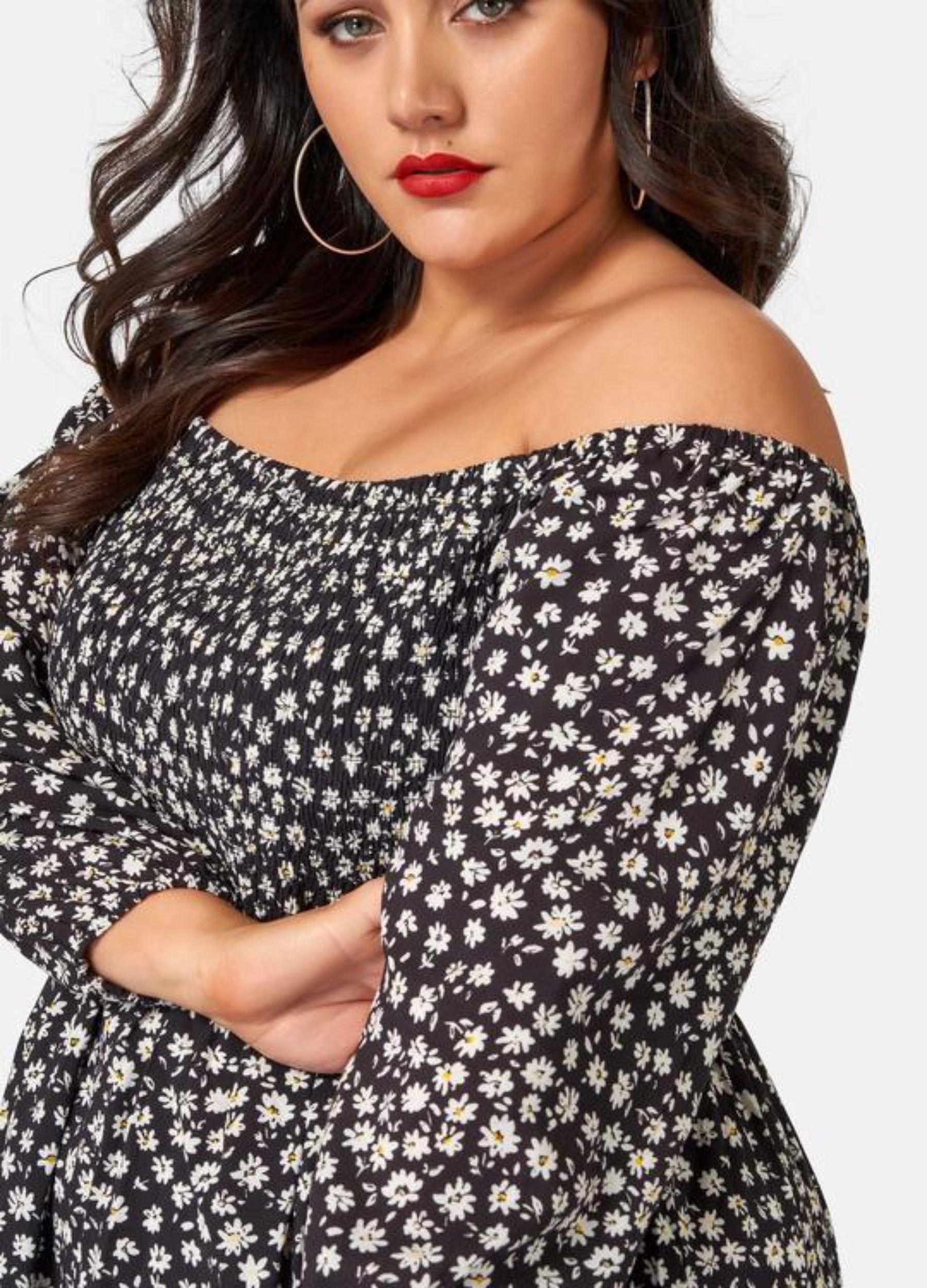 Curvy Woman wearing off shoulder floral print dress with 3/4 sleeve