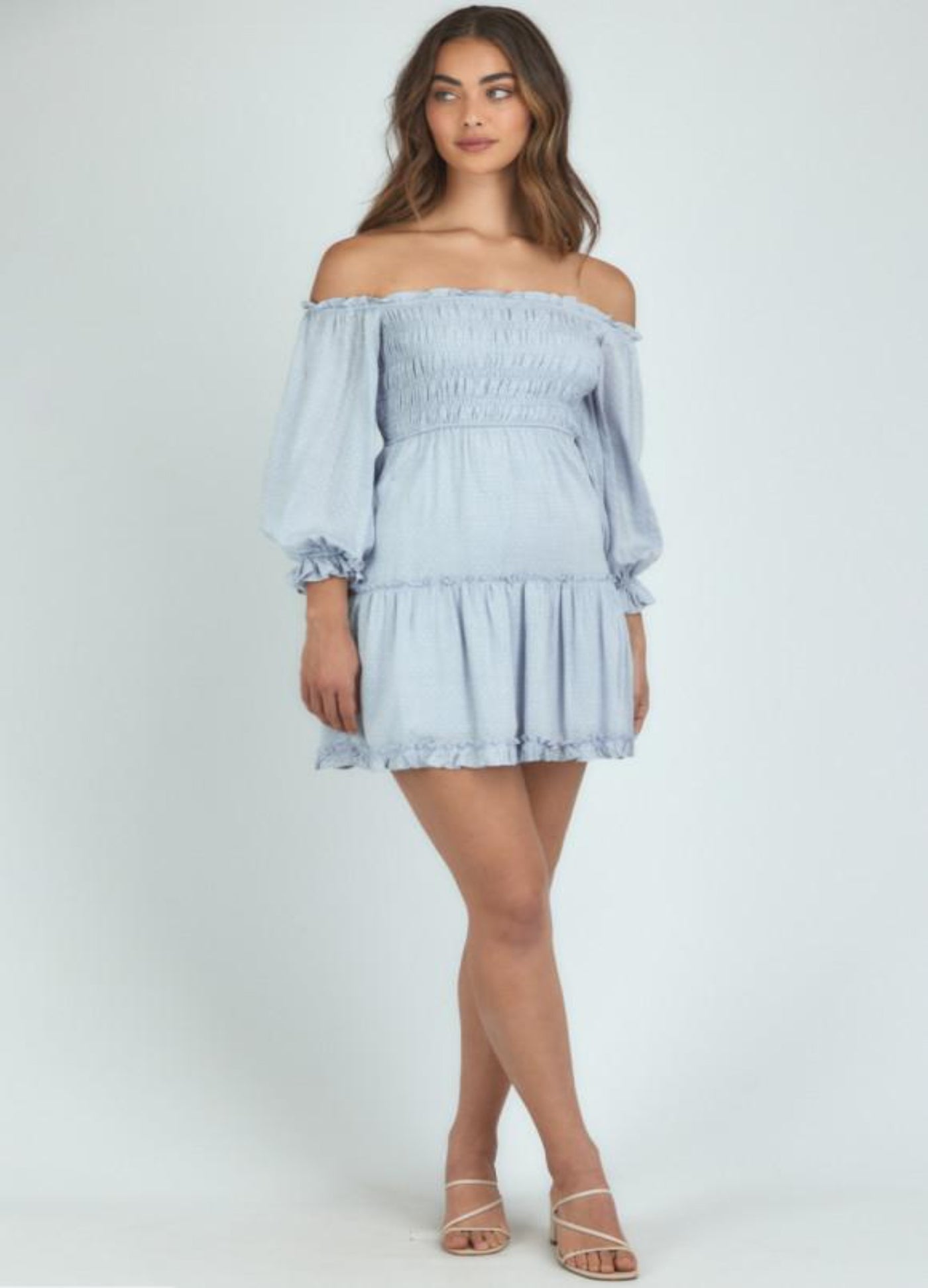 Brunette Model wearing the Mia bodice dress in pale blue