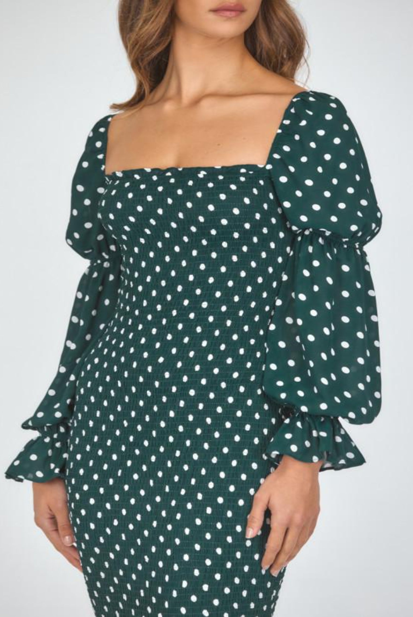Model wearing dot print dress