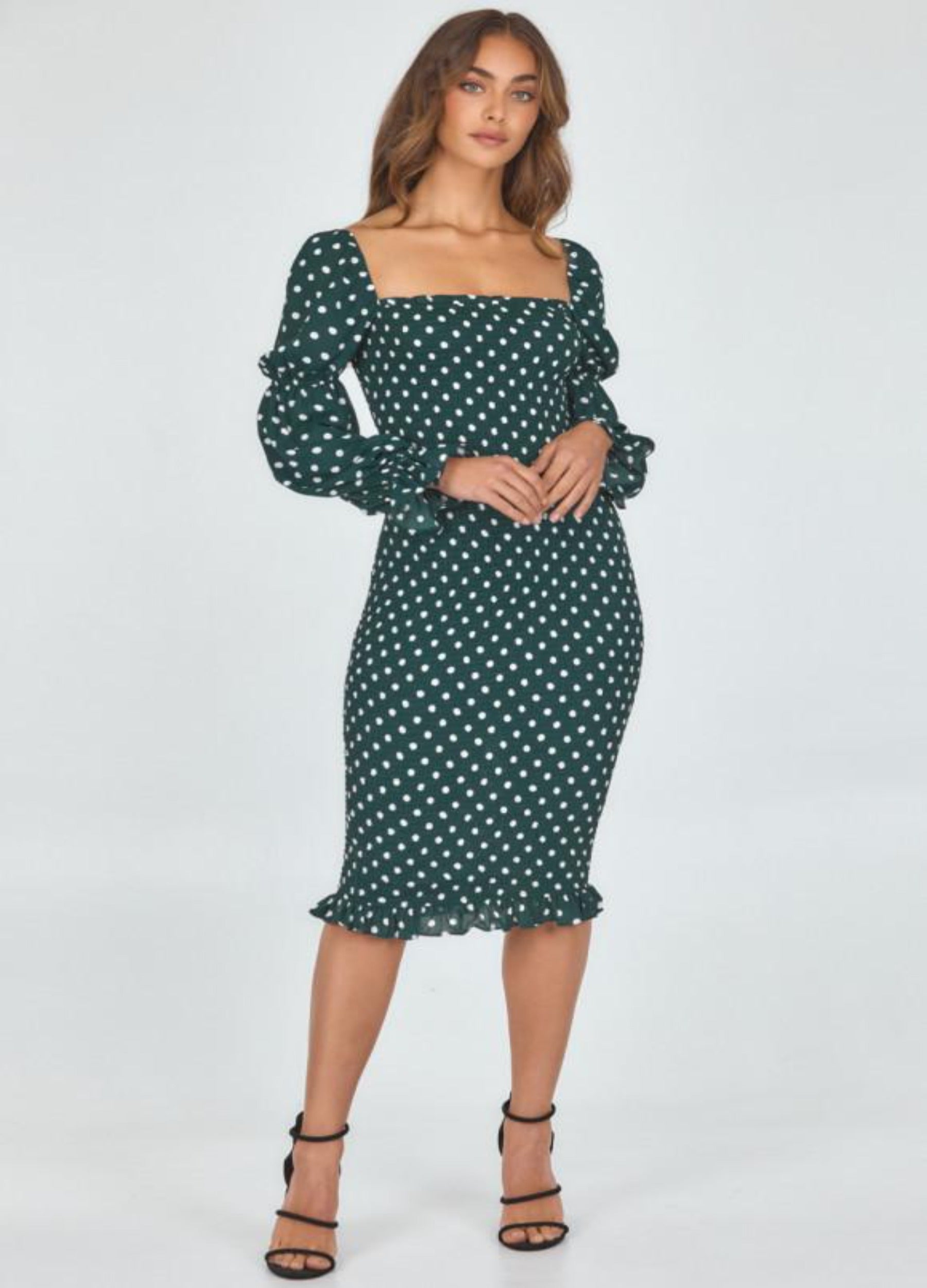 Model wearing dot print dress